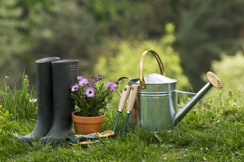 Gardener working in a Greenwich garden with tools